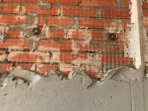 Правильная толщина штукатурки по кирпичу